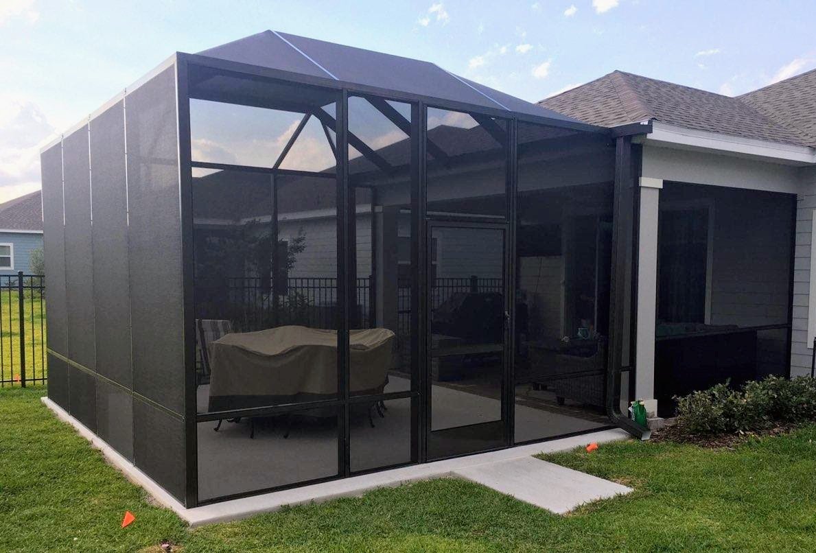 Screen room (screen cage) with a screened roof and screen door, built by Better Home Improvement in Jacksonville, FL