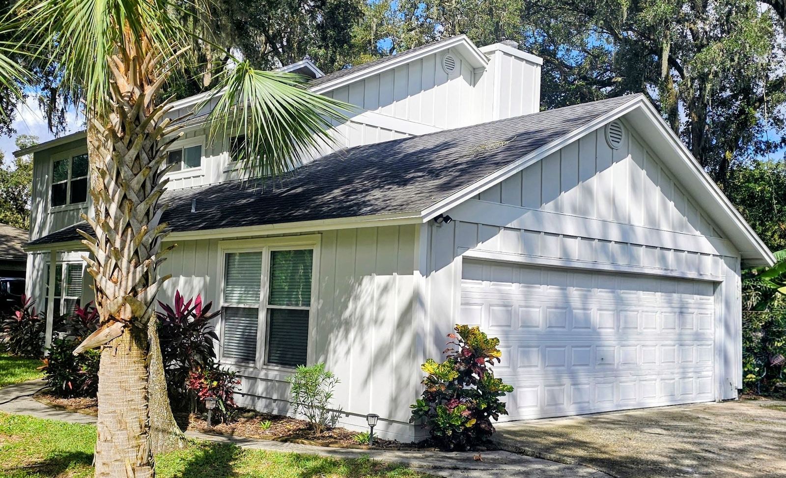 Two-story home with James Hardie board and batten siding installed by Better Home Improvement in Jacksonville, FL