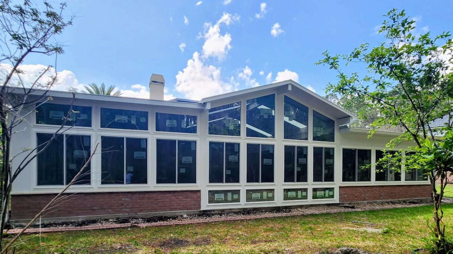 Gable sunroom with a brick kneewall, completed by Better Home Improvement in Jacksonville, FL