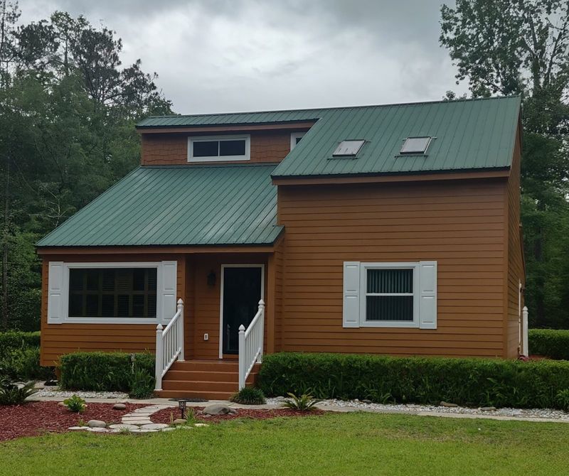 Front of a two-story home with Hardie lap siding installed by Better Home Improvement in Orange Park, FL